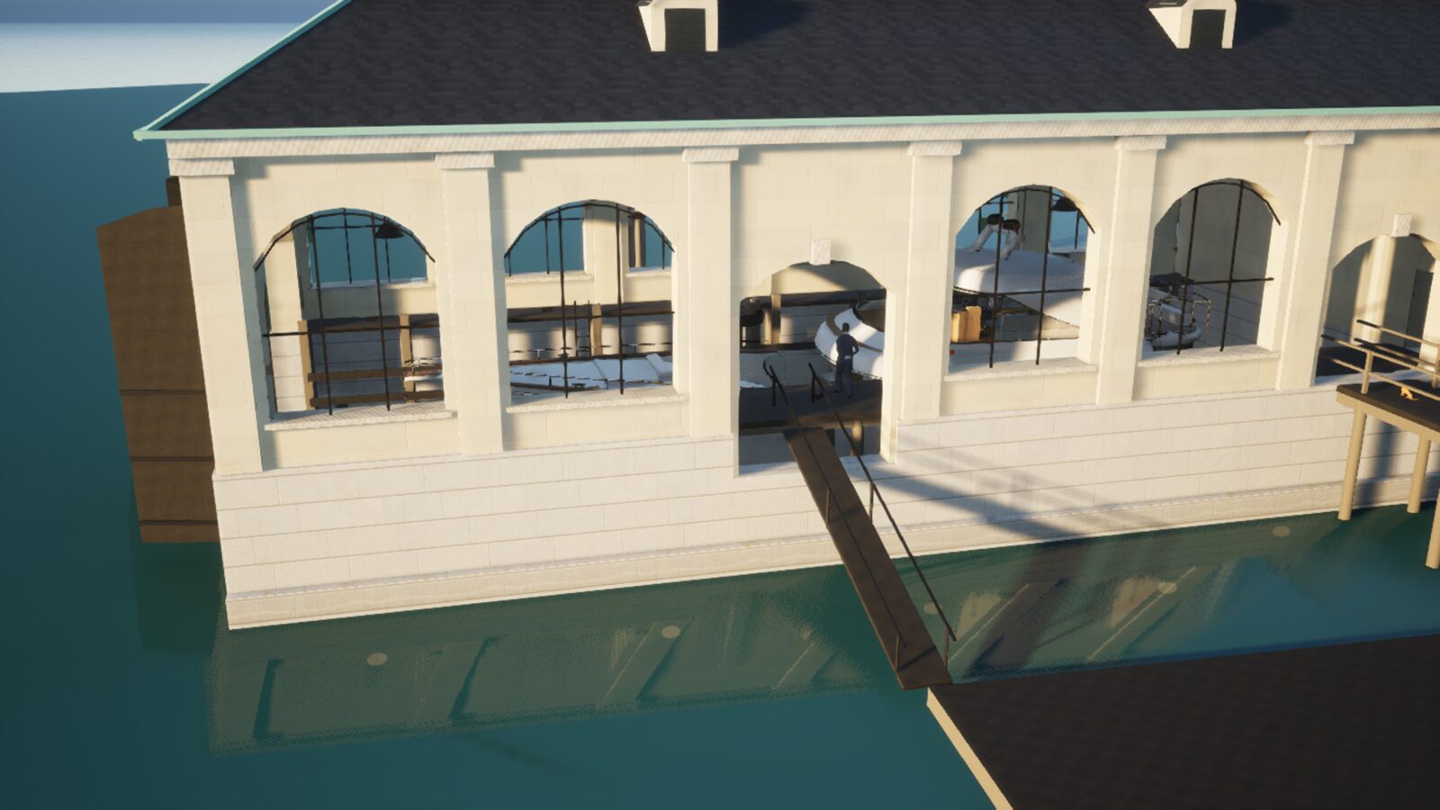 The boathouse and its dock on the water