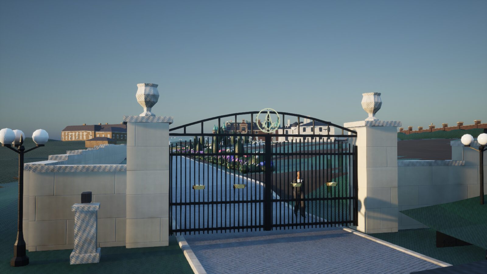 The iron entrance gates and stone piers at the end of the drive