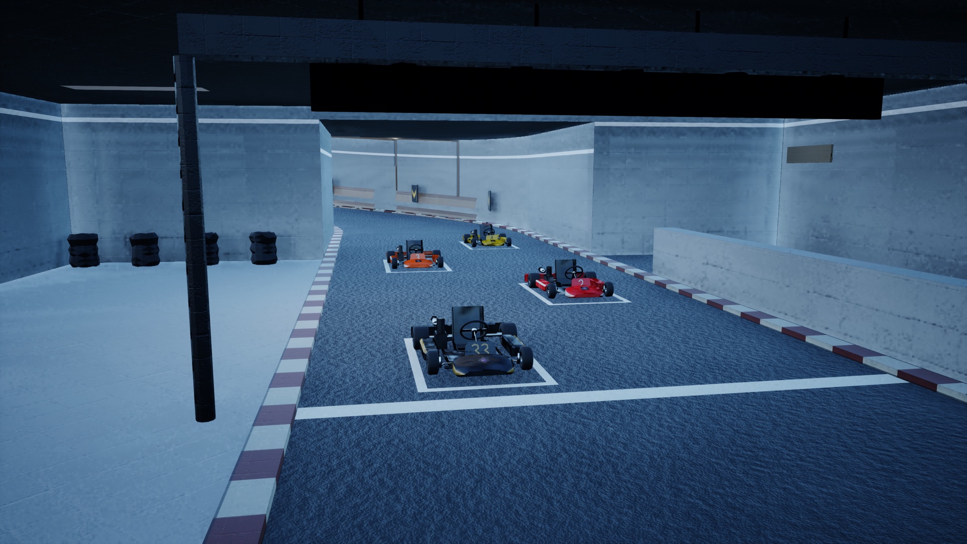 Four go-karts lined up on the starting grid